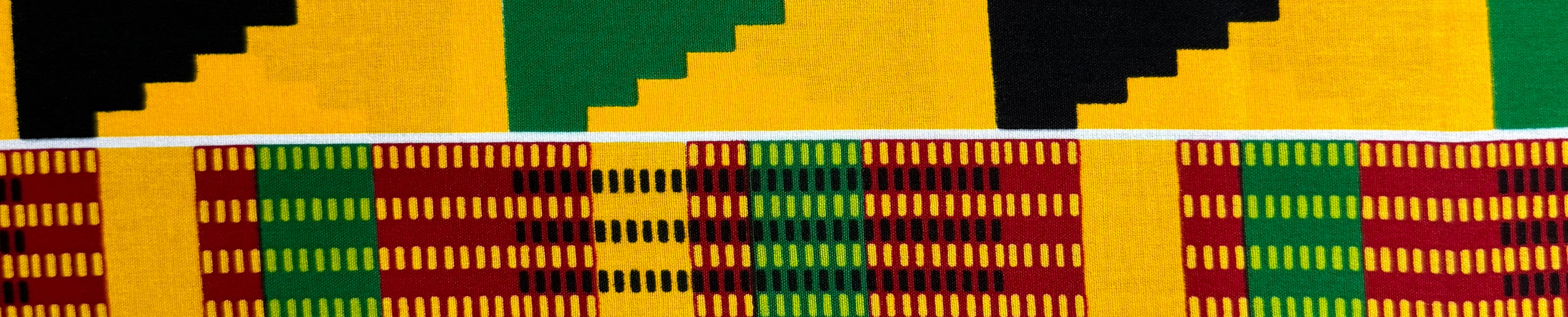Kente-inspired African print fabric with yellow, green, red, and black geometric patterns