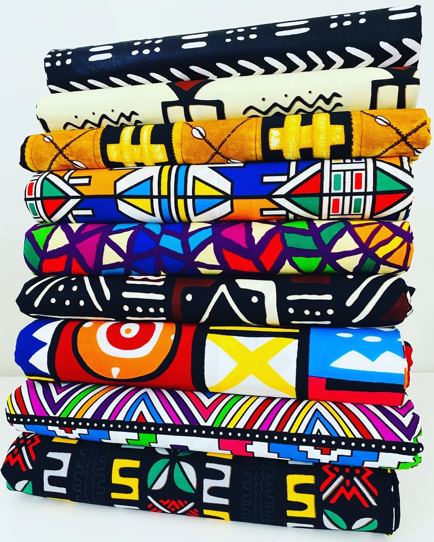 stack of african fabric tribal prints