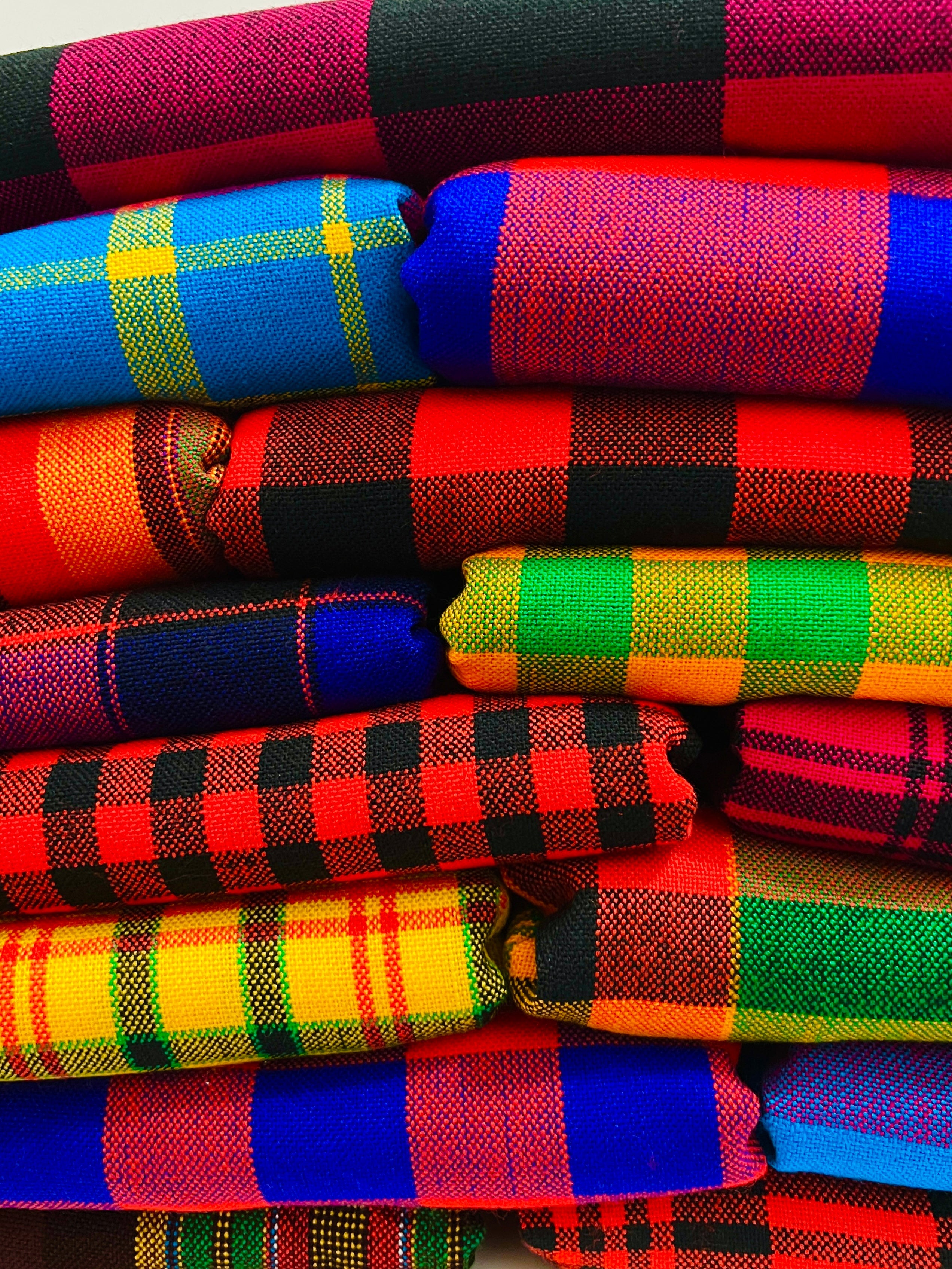 stack of colorful maasai shuka