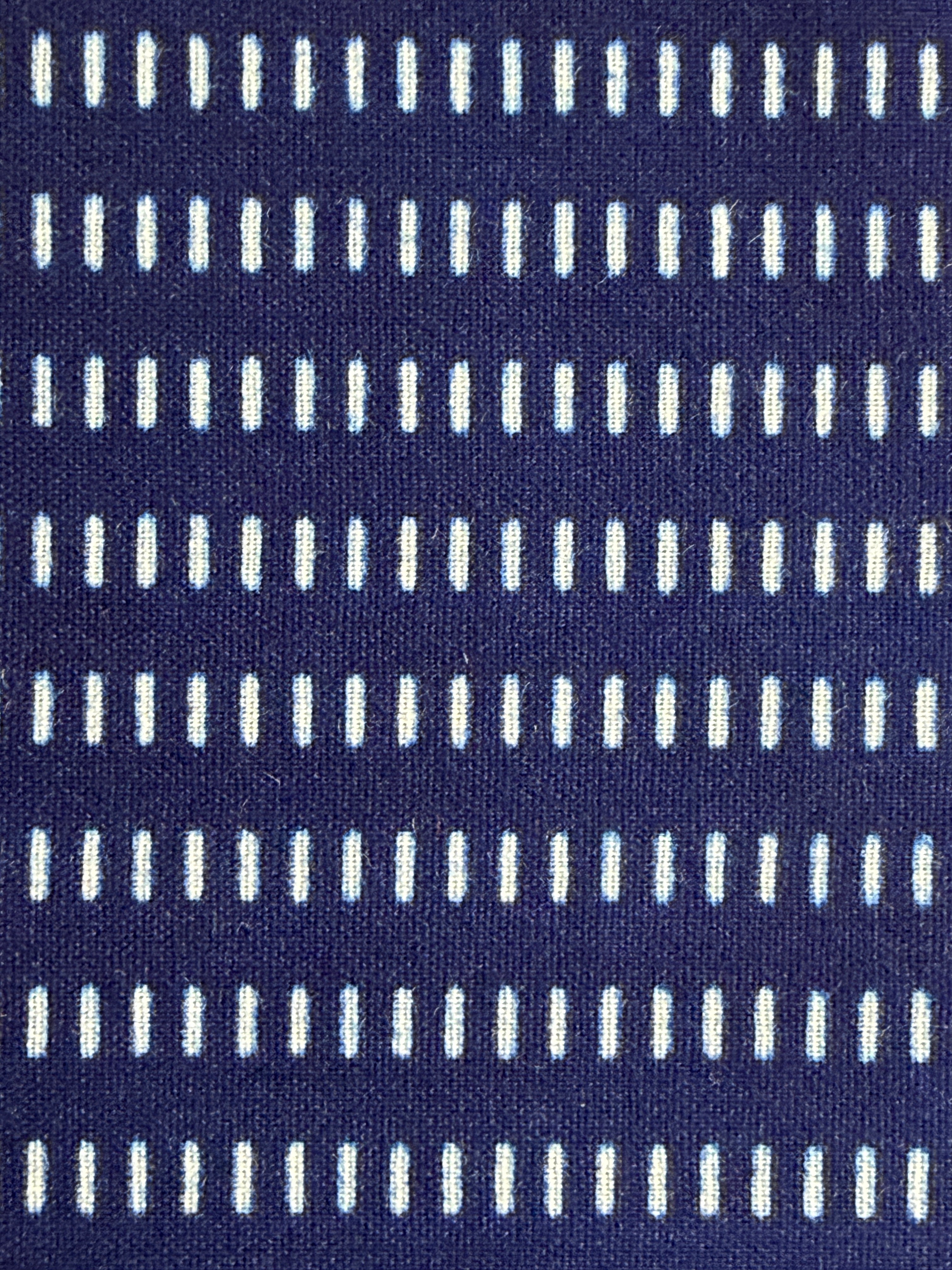 Navy blue fabric with white vertical stripes