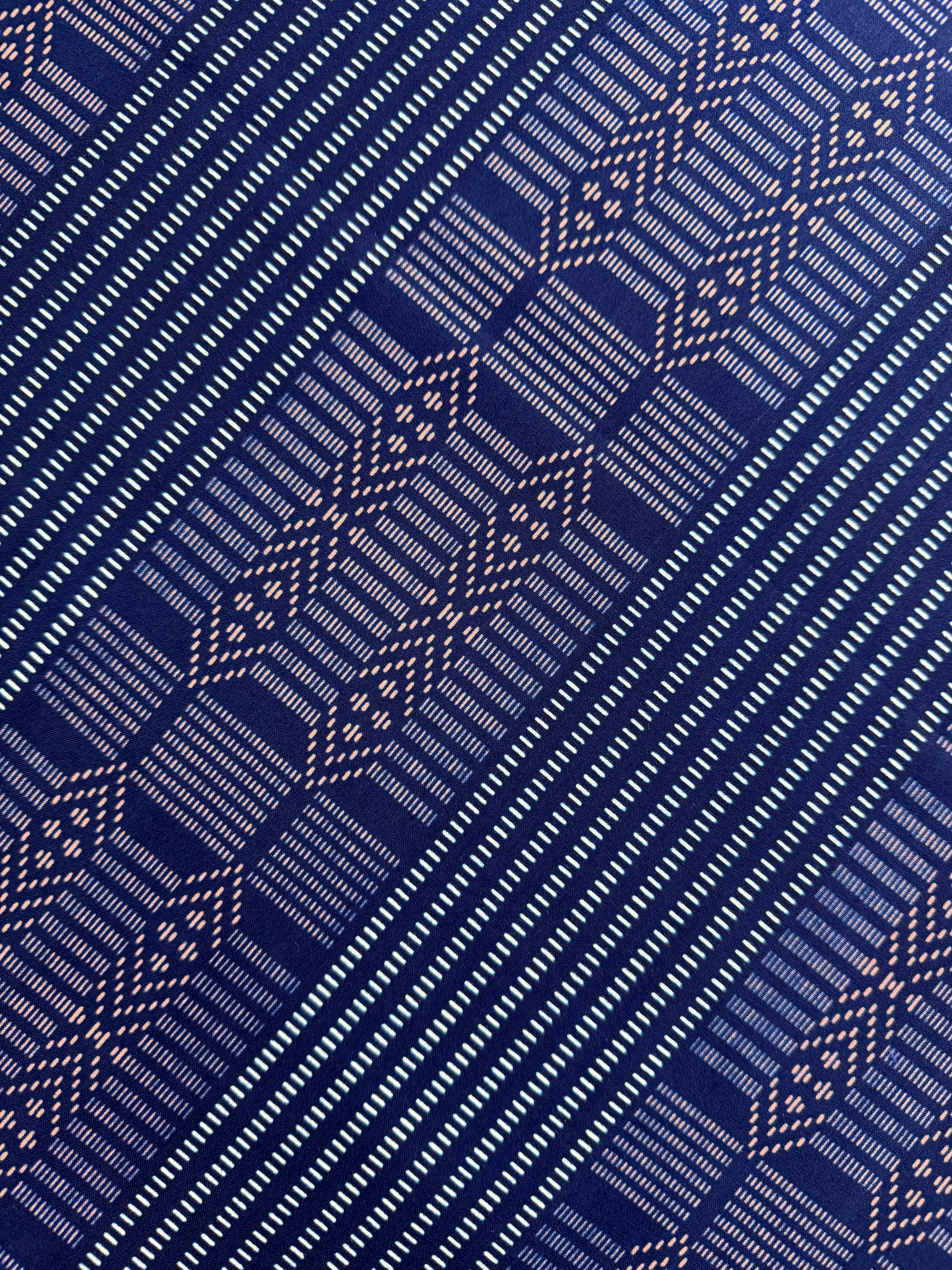 Close-up of a blue fabric with geometric pattern