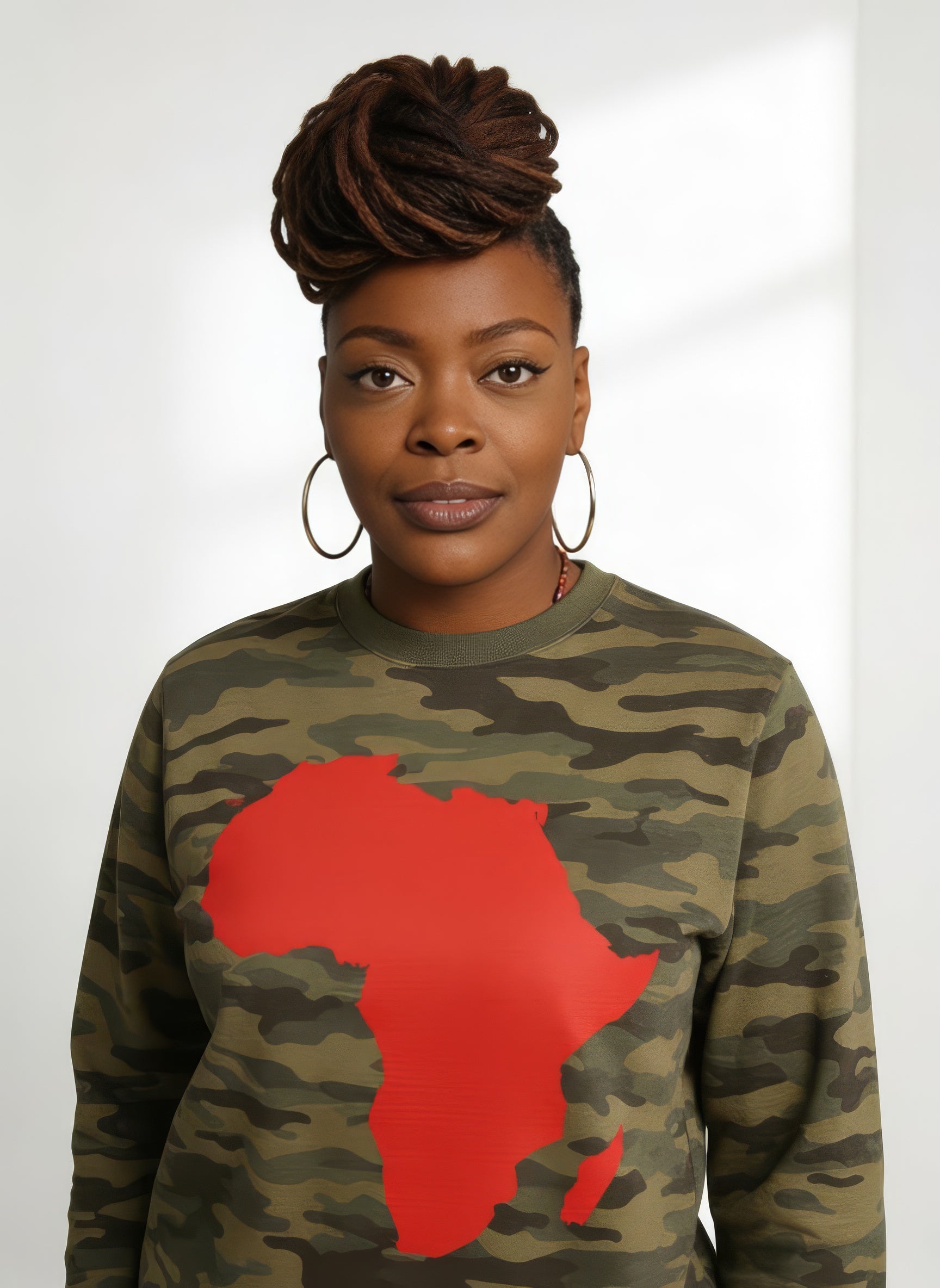 Person wearing a camouflage sweatshirt with a red Africa map design on a white background